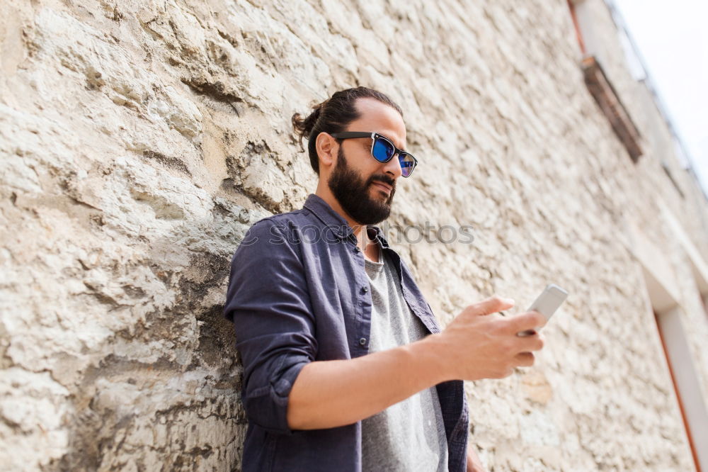 Similar – Traveler using smartphone on city