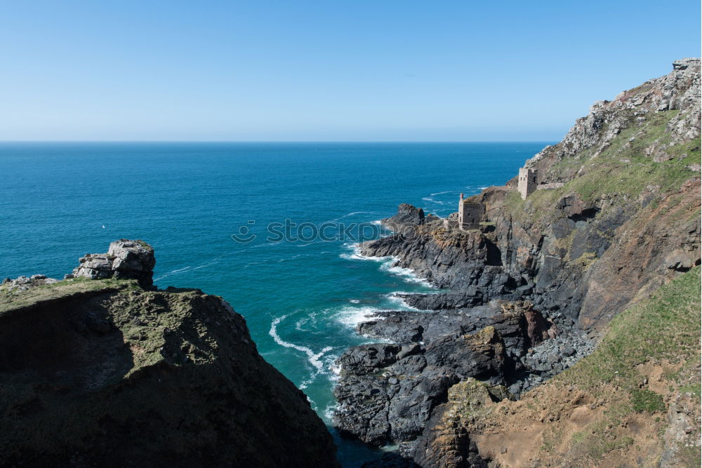 Similar – Beach landscape with cliffs