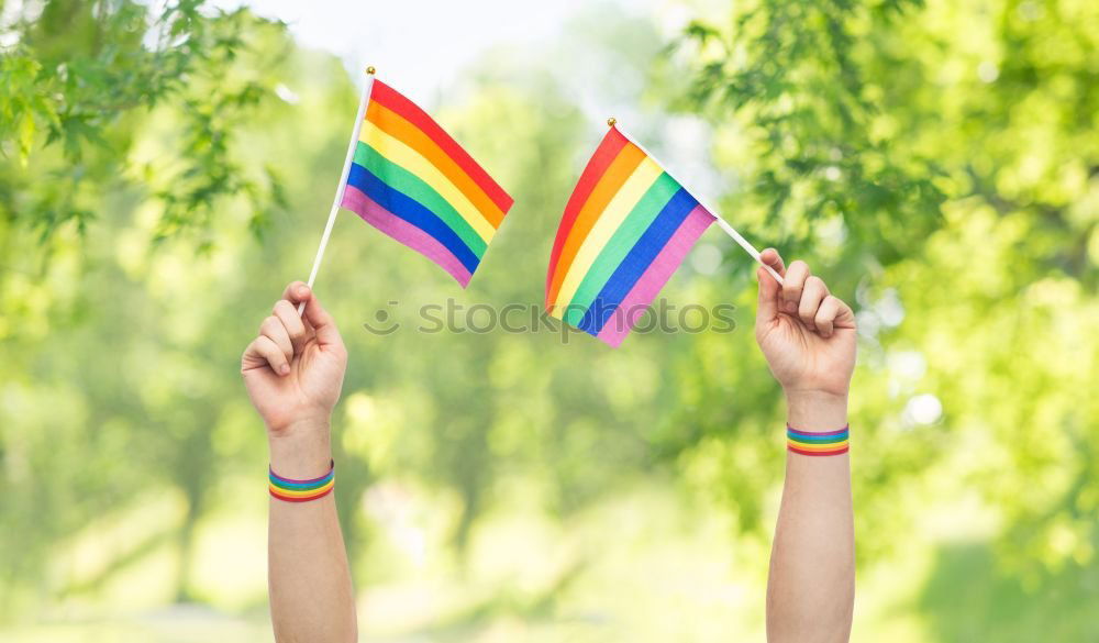 Similar – Image, Stock Photo Woman holding the Gay Rainbow Flag on green meadow outdoor