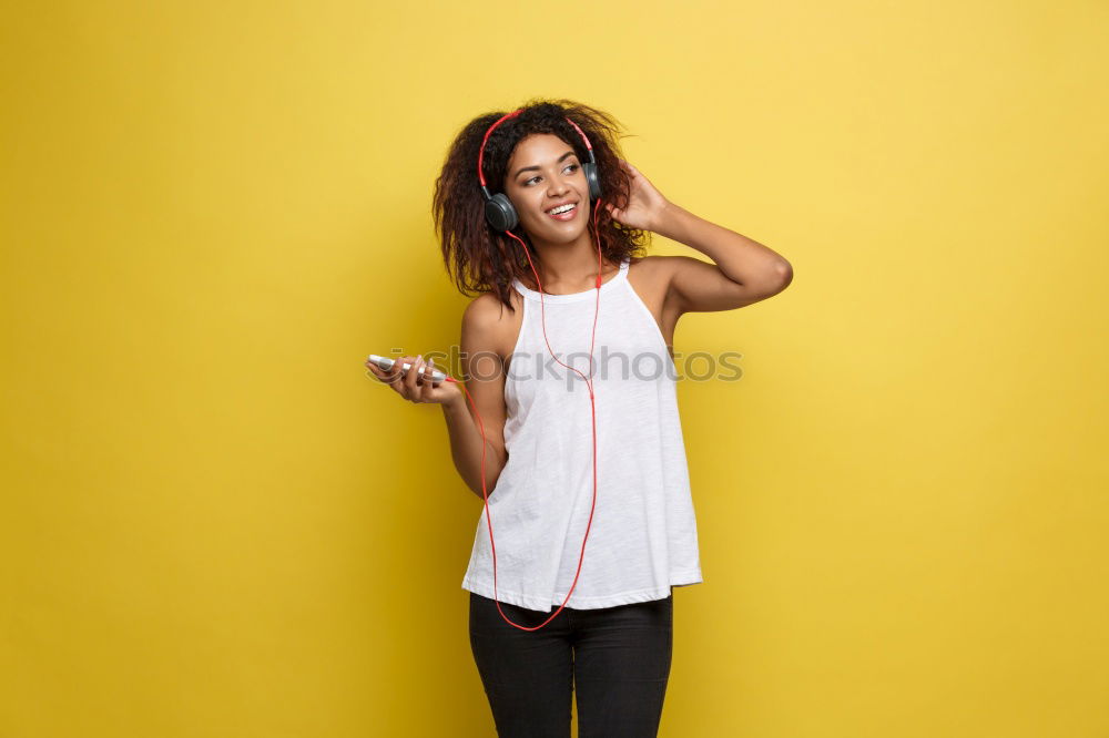 Similar – Young Arab woman listening to music with earphones outdoors