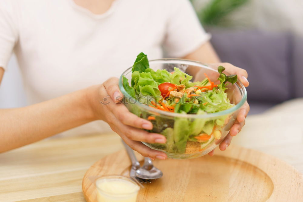 Image, Stock Photo Woman eating quinoa and vegetables in bowl