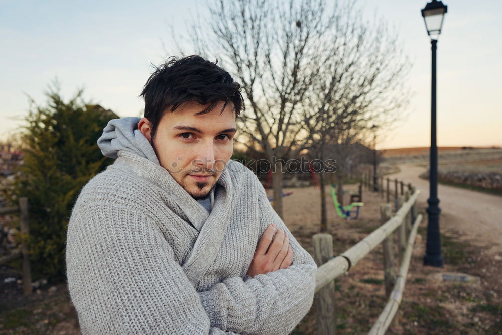 Young man posing outdoors