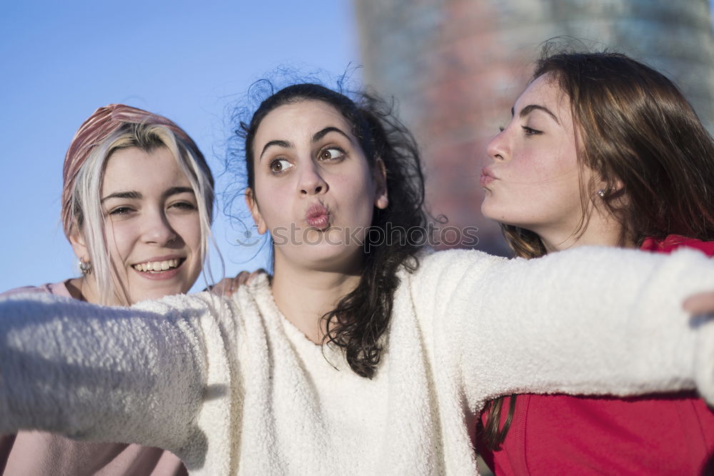 Lifestyle sunny image of best friend girls taking selfie