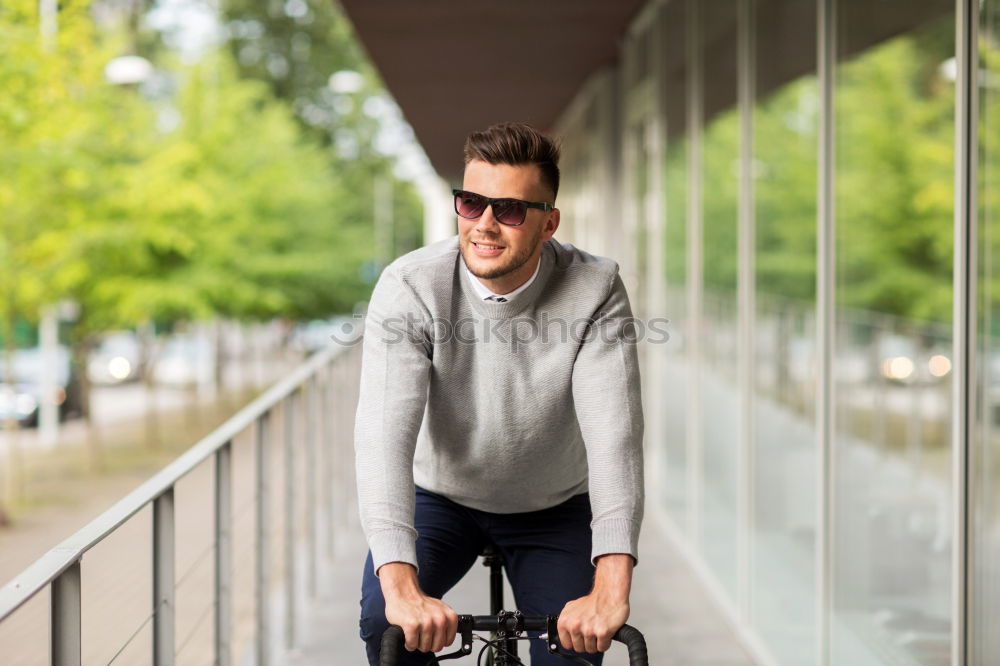 Similar – Man in the street wearing suit near a vintage bicycle.