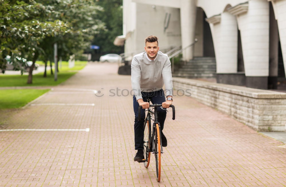 Similar – Man in the street wearing suit near a vintage bicycle.