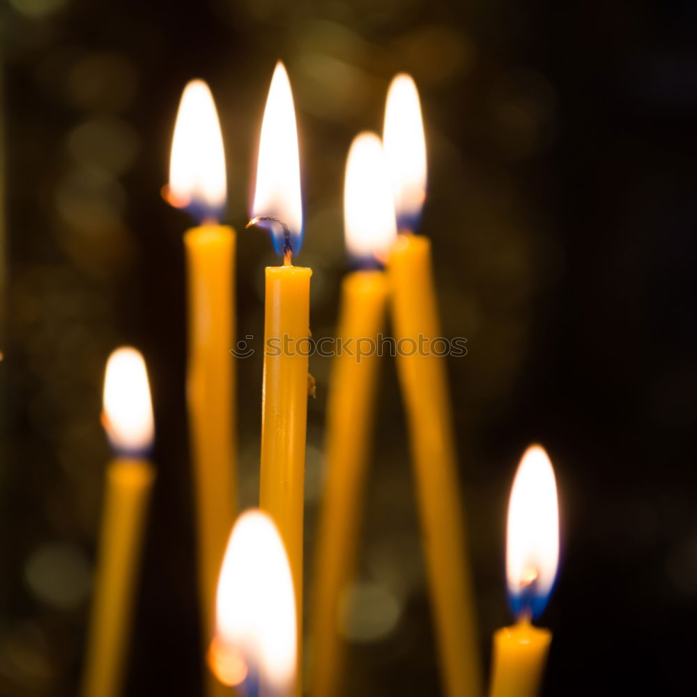 Similar – Lit beeswax candles in sand; Orthodox church