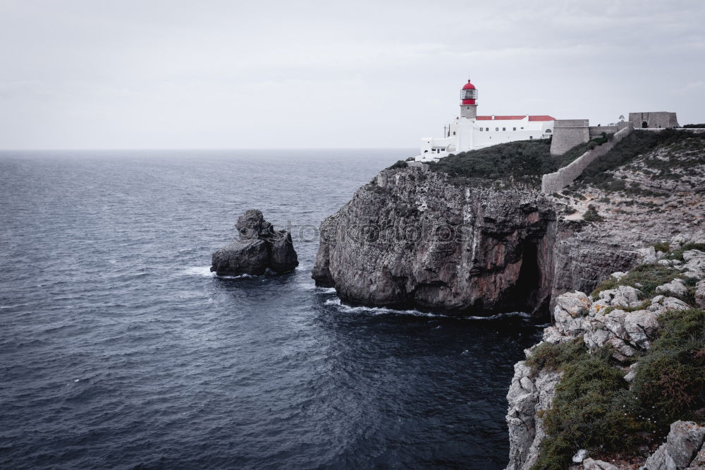 Similar – Lighthouse on cliff at Cabo São Vincente near Sagres in Portugal.