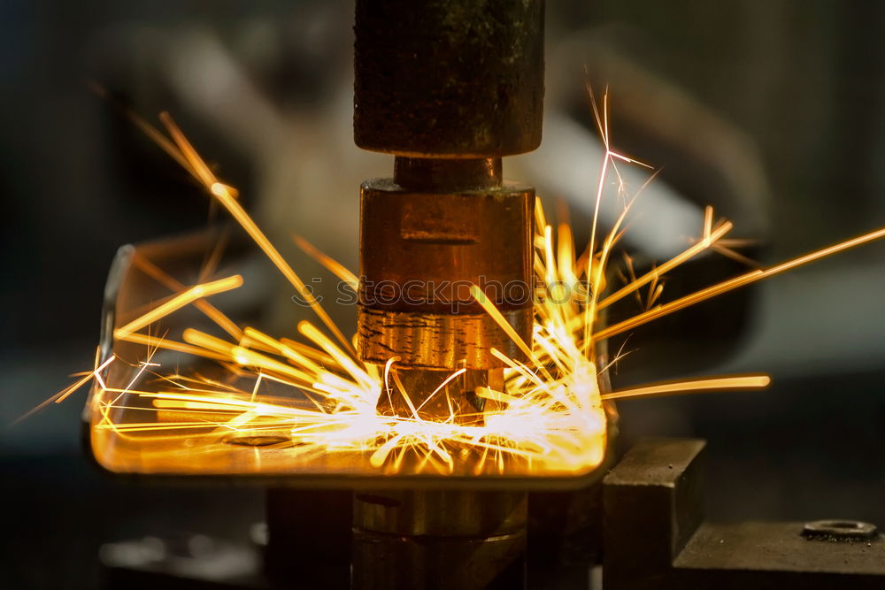 Similar – worker using an angle grinder