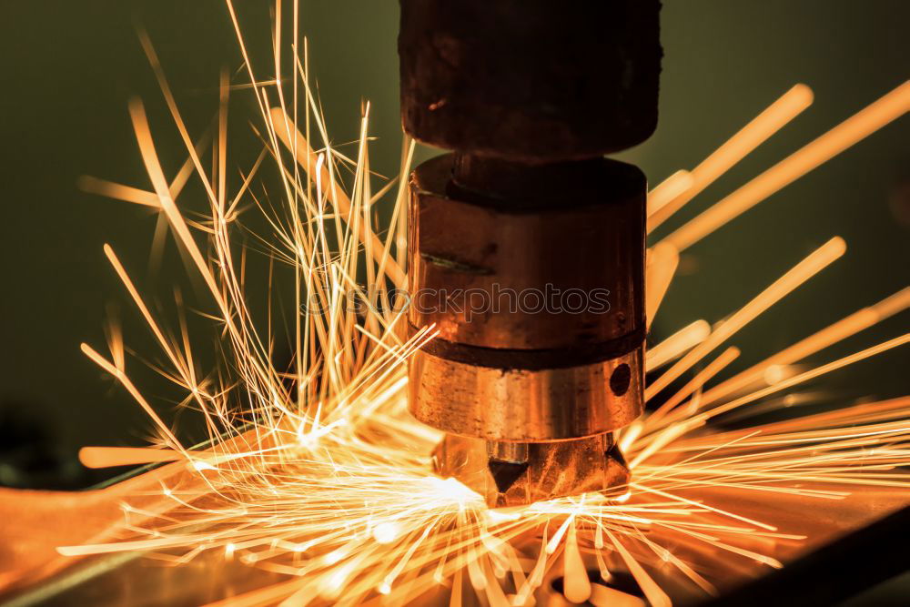 Similar – worker using an angle grinder