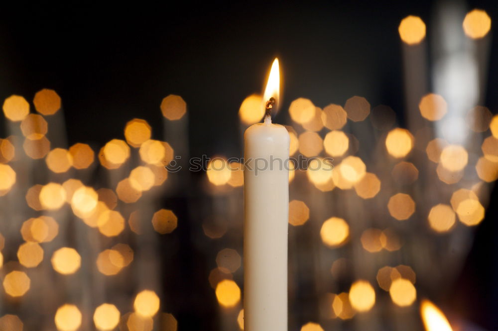 Similar – Advent arrangement with four candles. In the background the blurred lights of the Christmas tree.