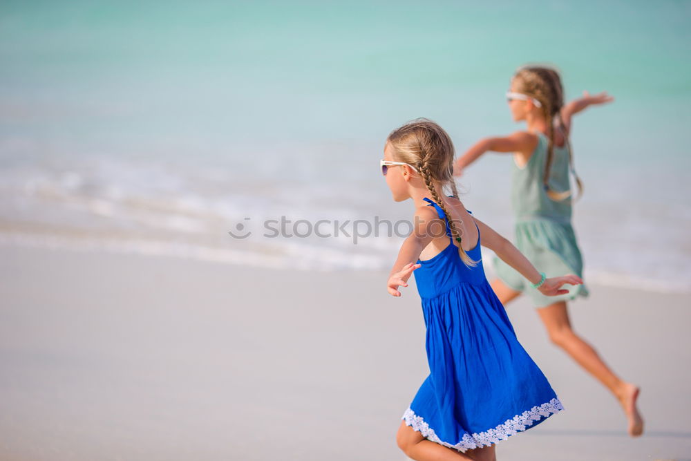 Similar – Image, Stock Photo Friends walking on the beach together on vacation