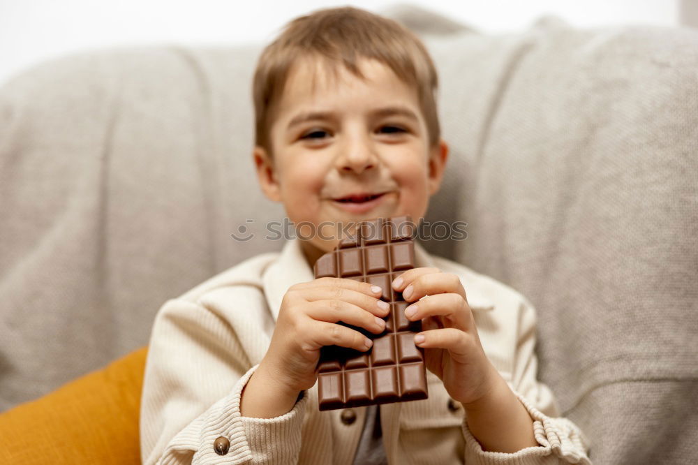 Similar – Boy holding figure on chess board