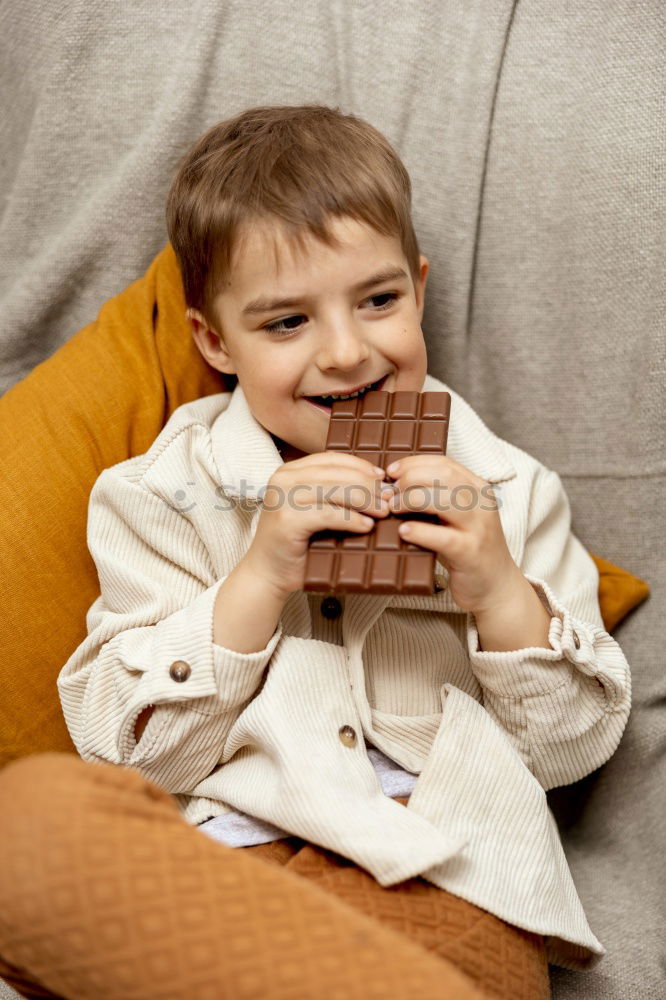 Similar – Image, Stock Photo little boy is lying on the bed and reading a book at the day time