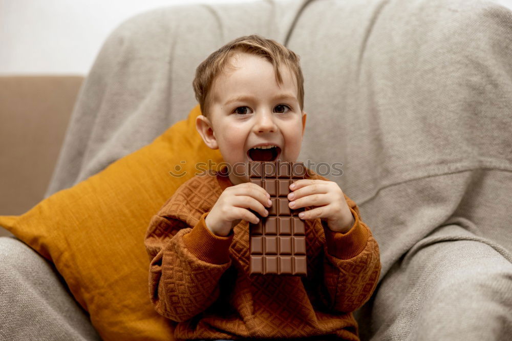 Similar – Toddler boy playing with new toy wearing pyjamas