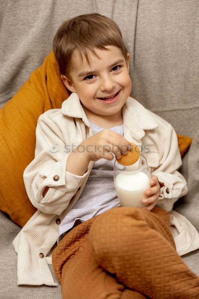 happy kid girl drinking tea for breakfast.