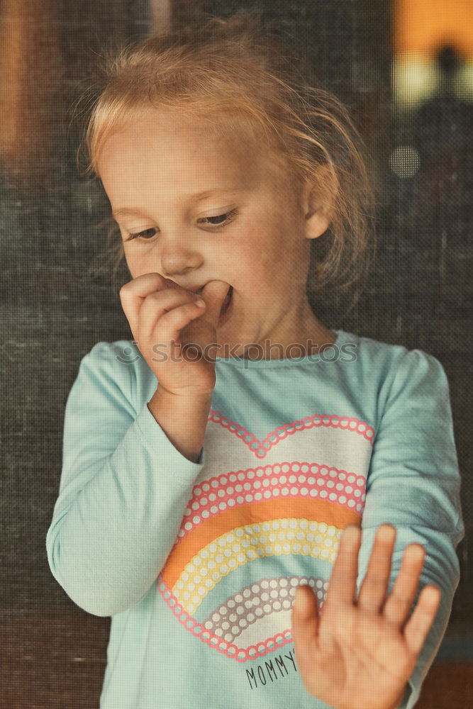 child girl having breakfast at home