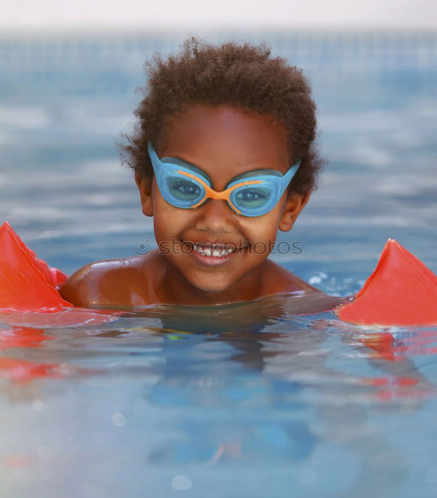 Similar – One little happy boy playing on the inflatable circle in swimming pool at the day time. Concept of friendly family.