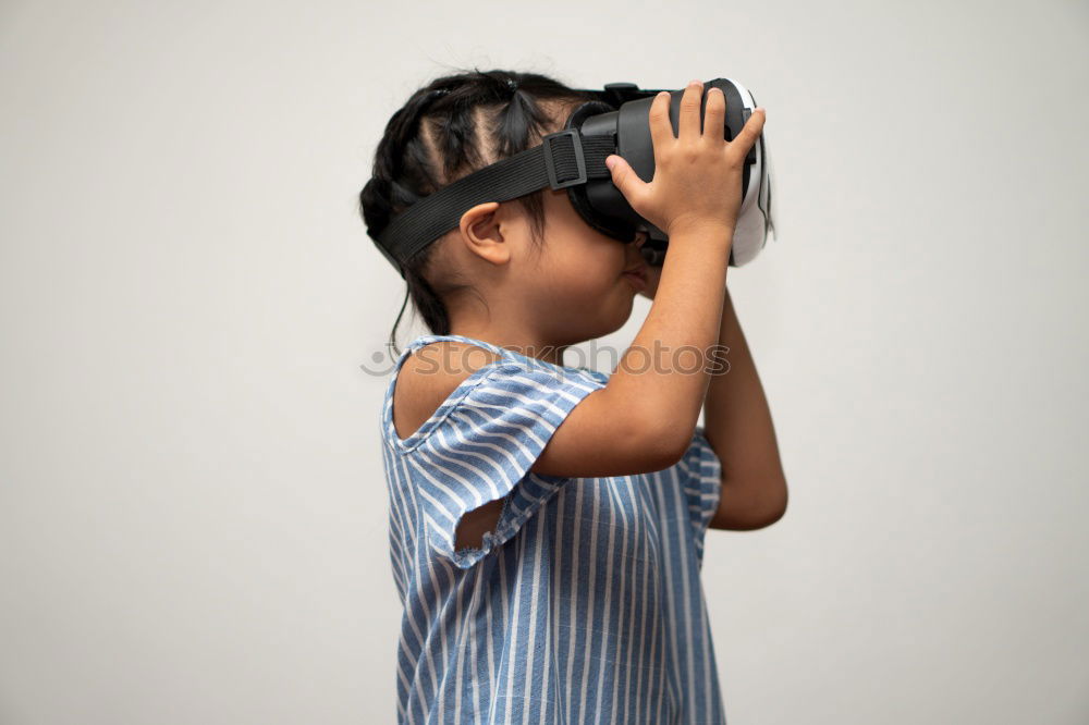 Similar – Image, Stock Photo young black woman wears virtual reality VR headset