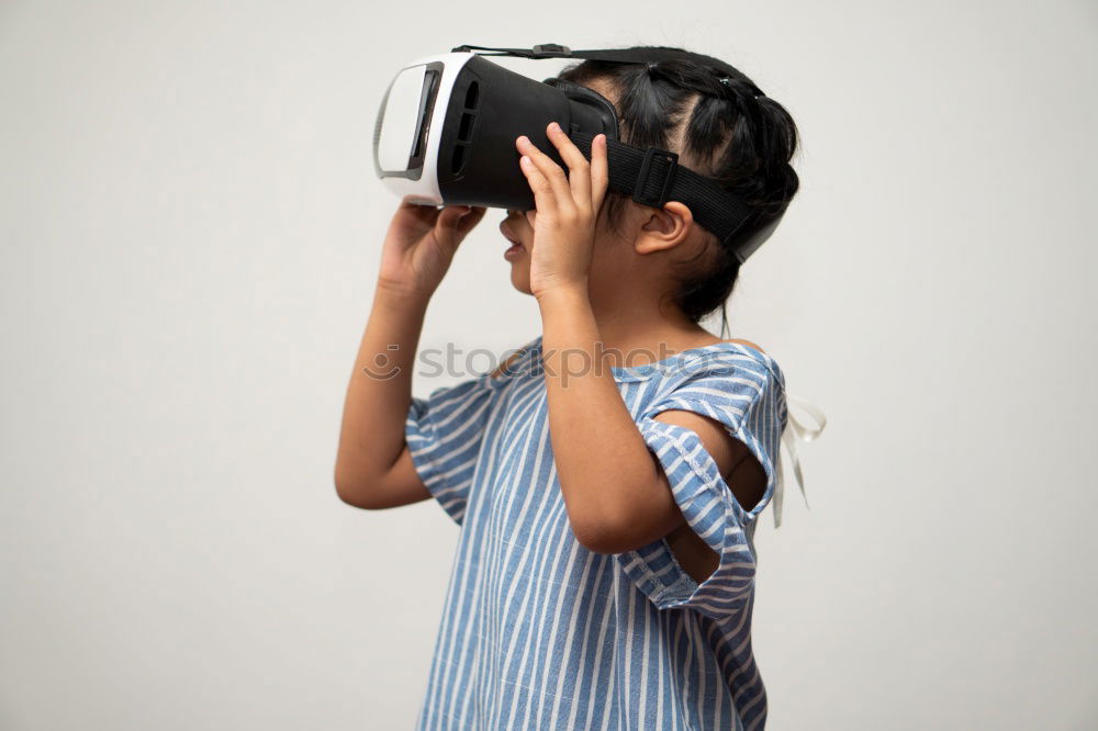 Similar – Image, Stock Photo young black woman wears virtual reality VR headset