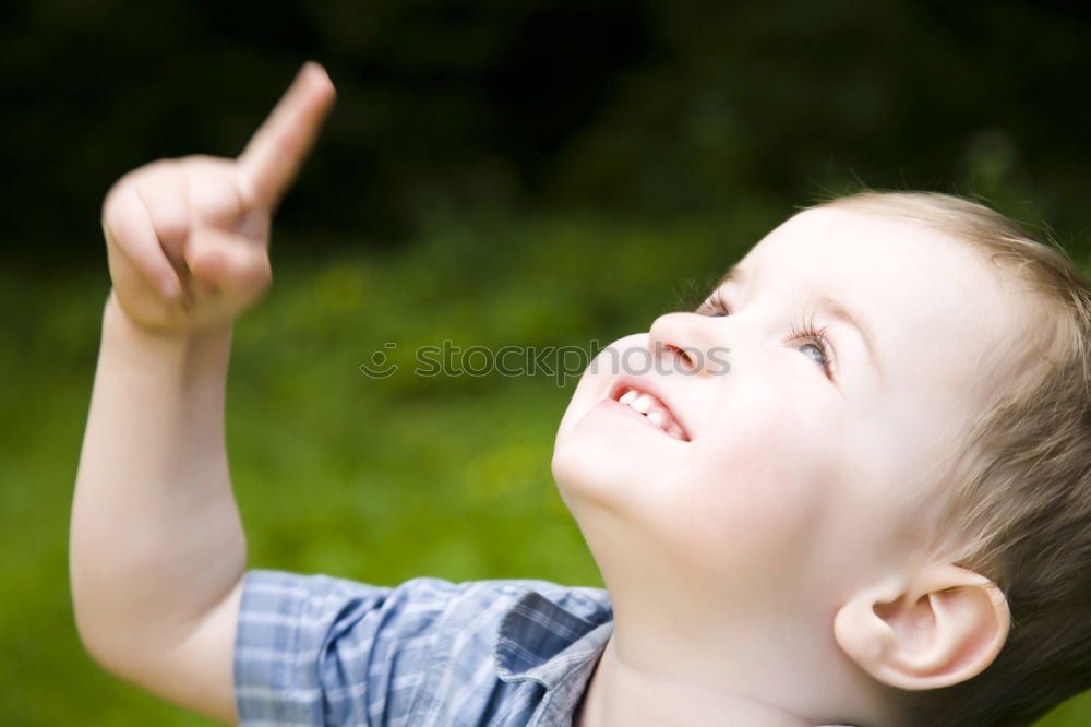 Similar – Image, Stock Photo Funny, funny, cheerful, happy, funny blonde girl outside in the garden, looks up and stretches both arms up to the tree. Little joker does nonsense, sticks out her tongue, in nature, in the park under the tree.