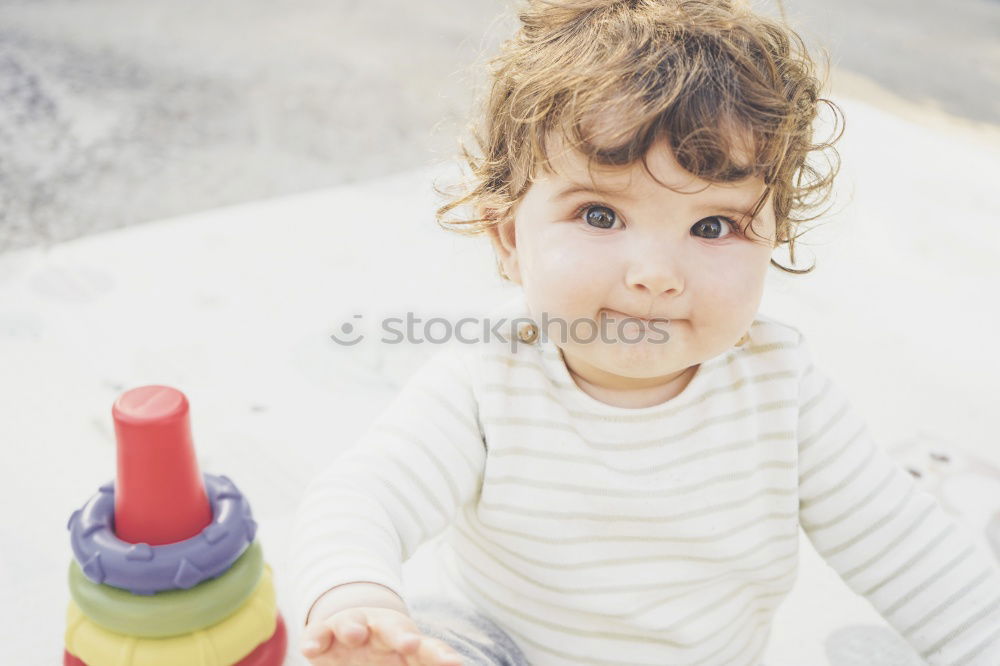 Similar – Little girl putting on her socks