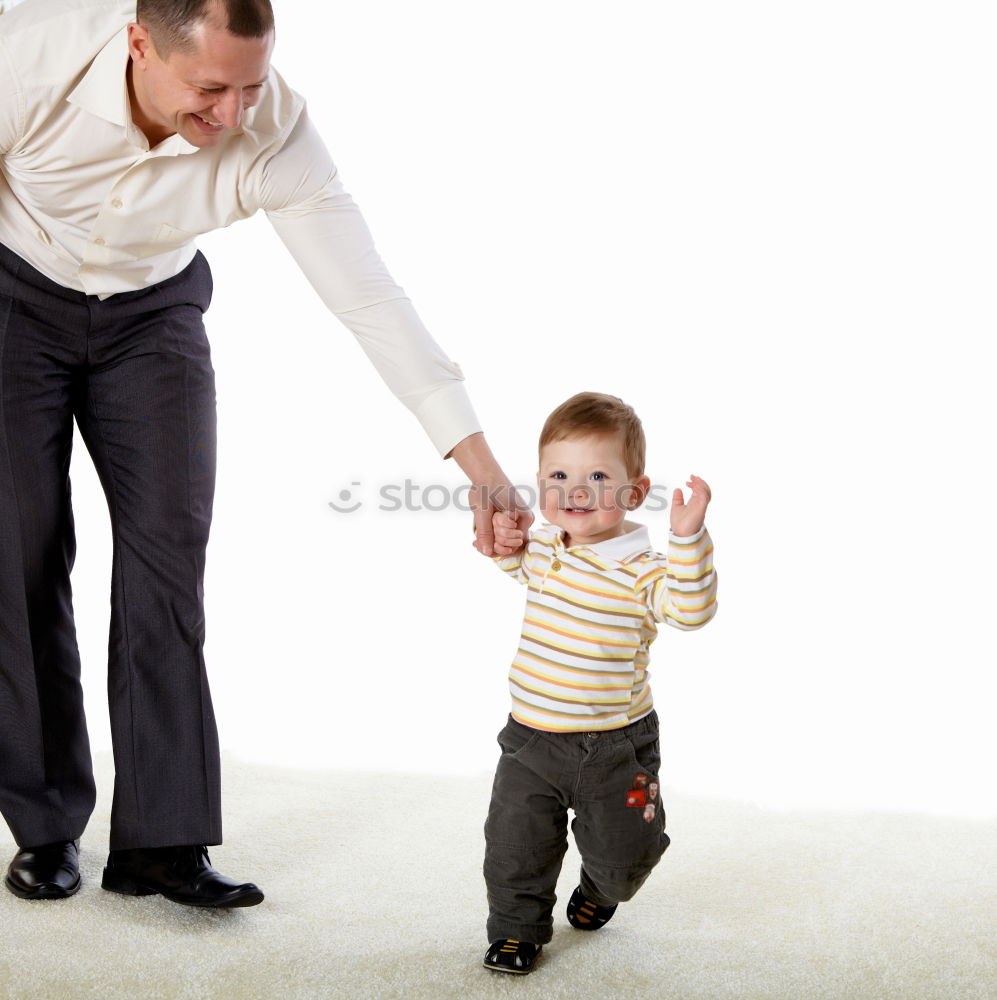 Similar – sad son hugging his dad near wall at the day time