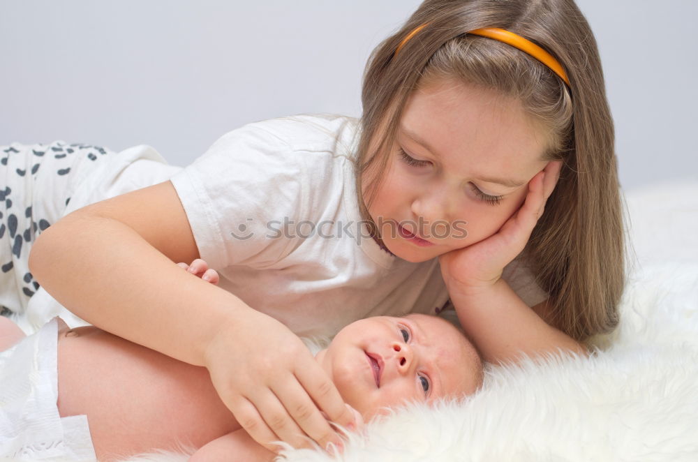 Similar – Image, Stock Photo Close-up of mother breastfeeding her little baby on the patio