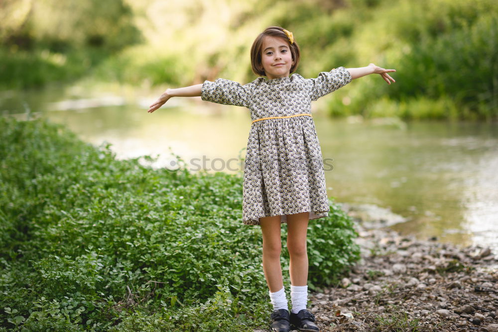 Similar – Kleines Mädchen im Naturfeld mit schönem Kleid