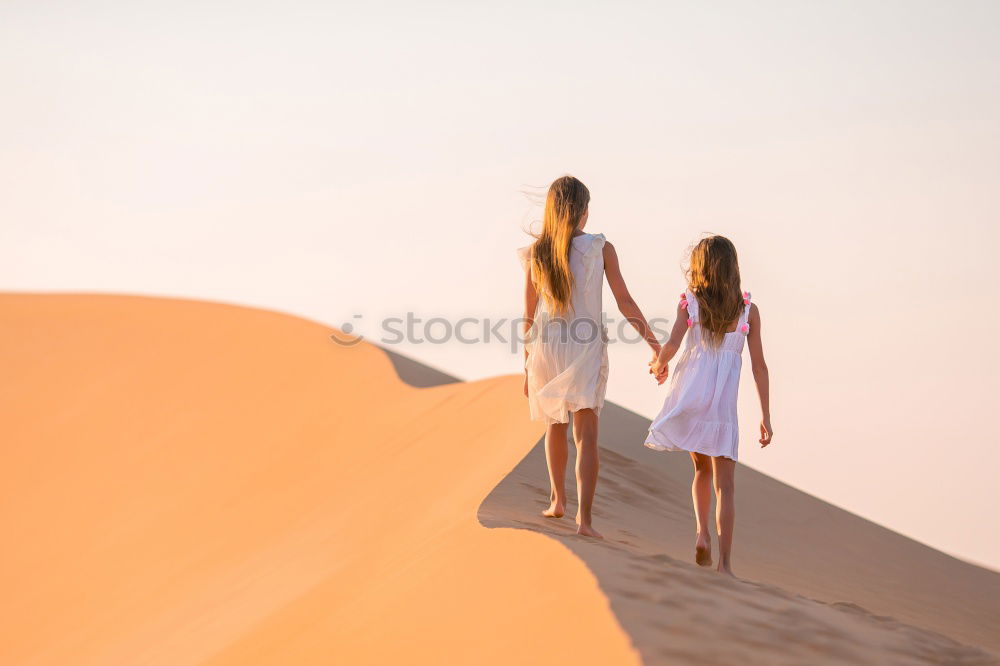 Similar – Happy women walking on hill