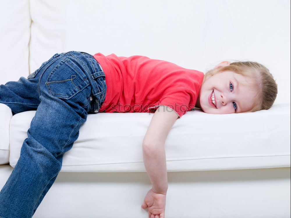 Head boy lying on knees of his pregnant mother