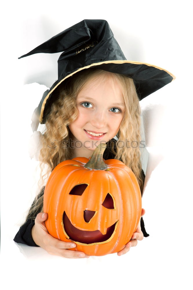 Similar – Image, Stock Photo Little girl holding a pumpkin in her hands, on Halloween.