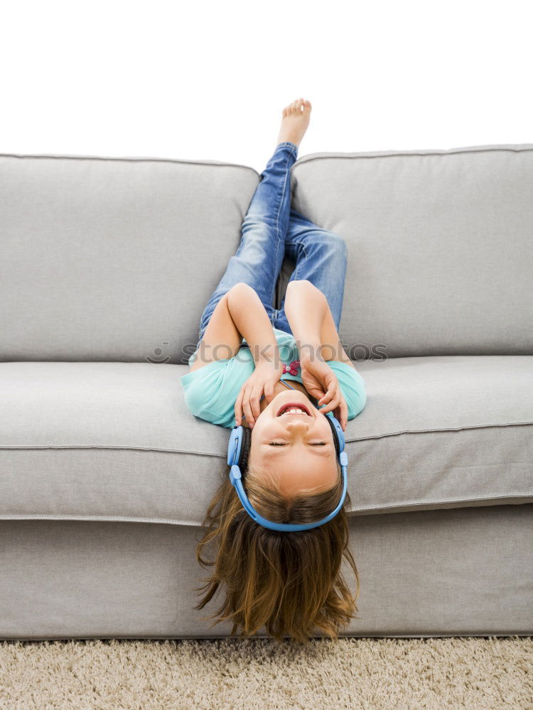 Similar – Image, Stock Photo Young girl looking at mobile phone while sitting on bed