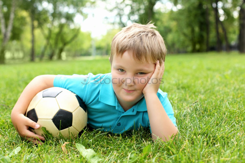 Similar – Portrait of a young boy with soccer ball. Concept of sport.