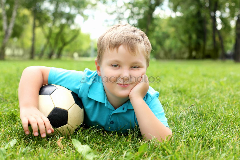 Similar – Portrait of a young boy with soccer ball. Concept of sport.