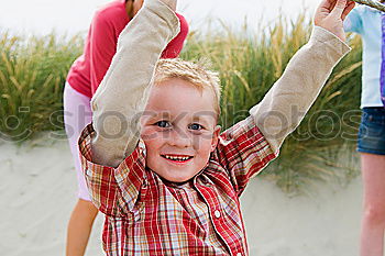 Similar – Image, Stock Photo Mother and son playing on the beach at the day time.