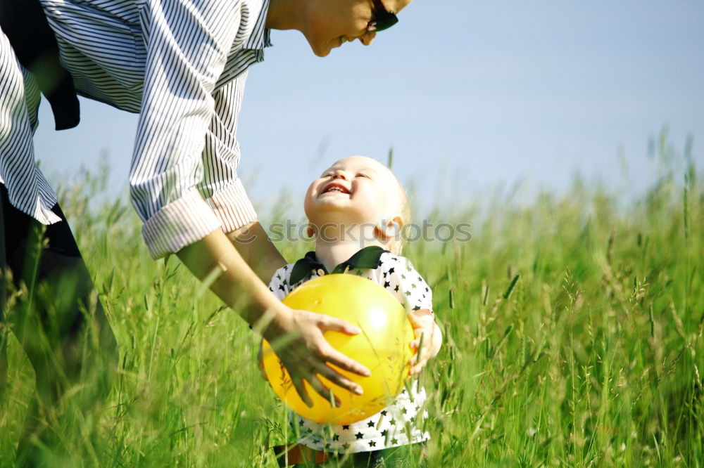 Similar – Image, Stock Photo Father and son playing at the park near lake at the day time.