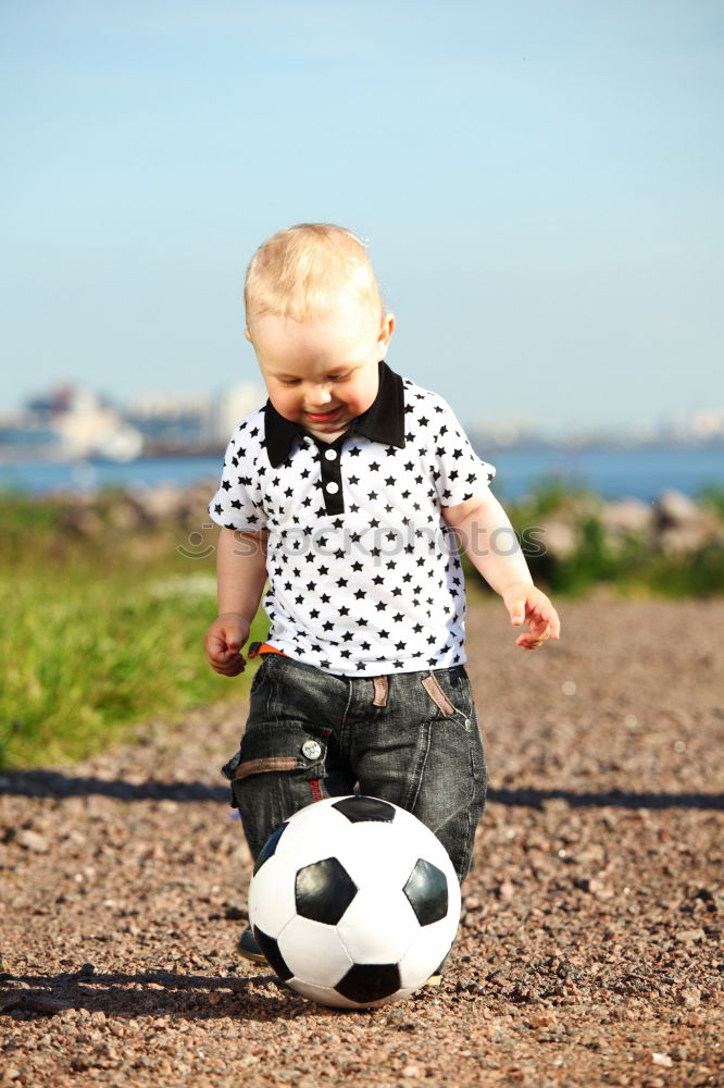 Similar – Image, Stock Photo child plays soccer with a ball