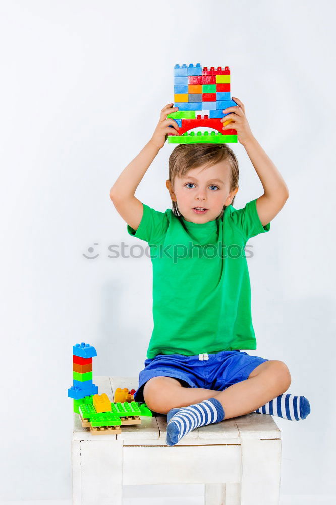 Similar – Image, Stock Photo Happy baby playing with toy blocks.