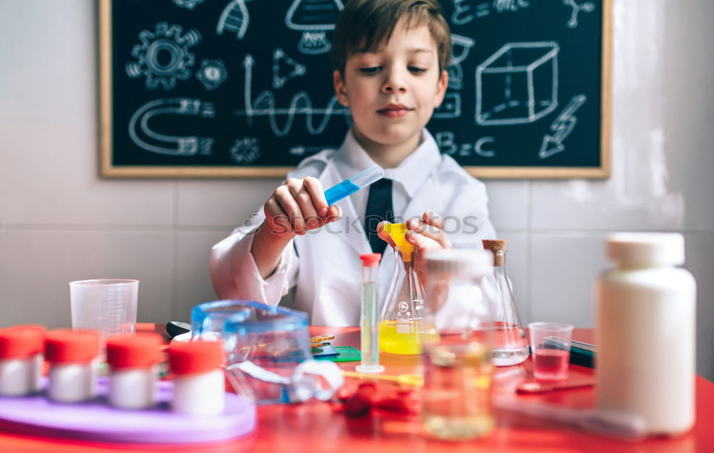 Similar – Image, Stock Photo Boy playing with chemistry game