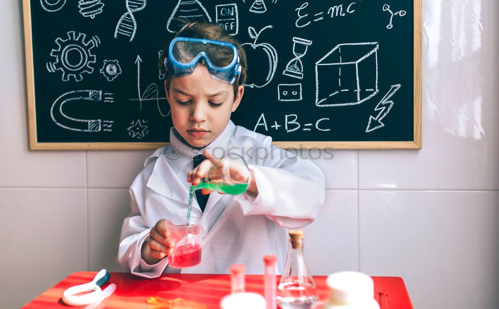 Similar – Image, Stock Photo Boy dressed as chemist with dirty face after doing an experiment