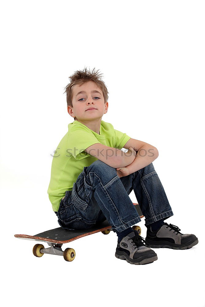 Similar – Image, Stock Photo A smiling boy with skateboard sitting alone on the floor