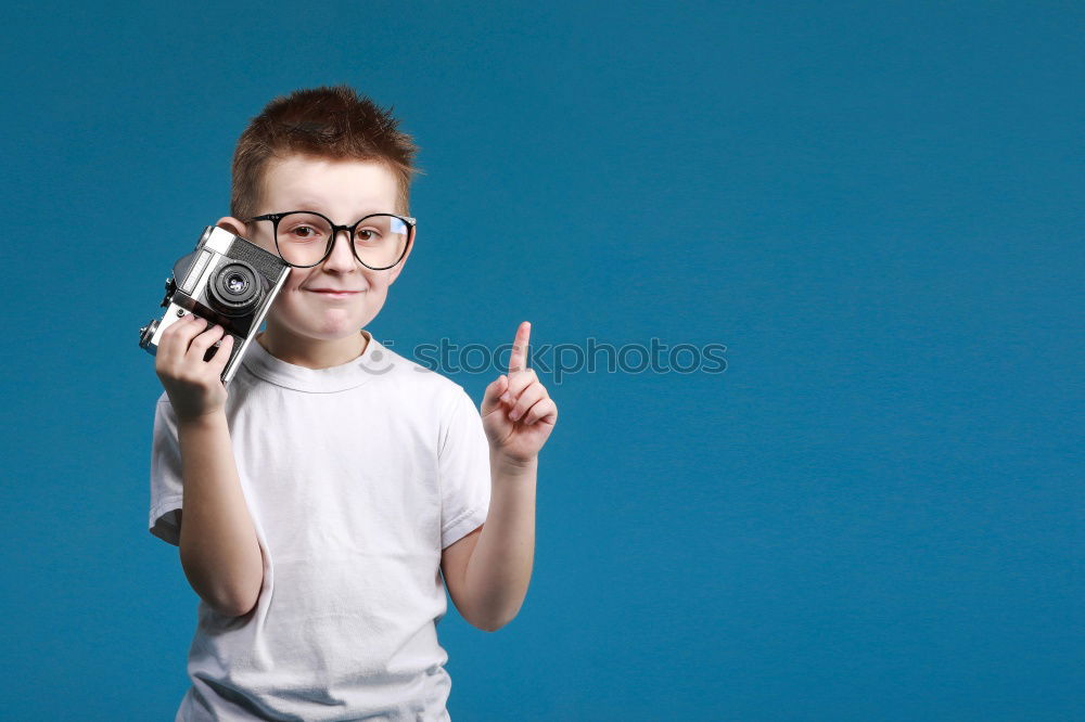 Similar – Angry young woman holding a retro clock