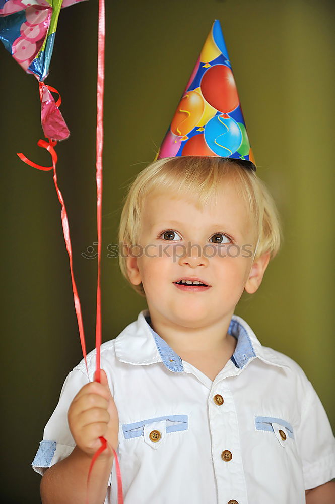 Image, Stock Photo Closeup facial portrait of a happy laughing little boy with wavy blond hair looking directly into the camera