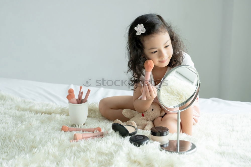 Similar – Image, Stock Photo afrcian girl giving teddy sweets at home