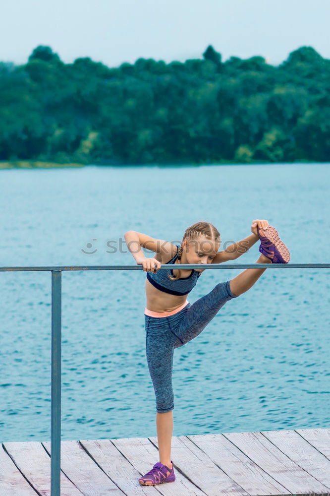 Similar – Woman stretching legs in park