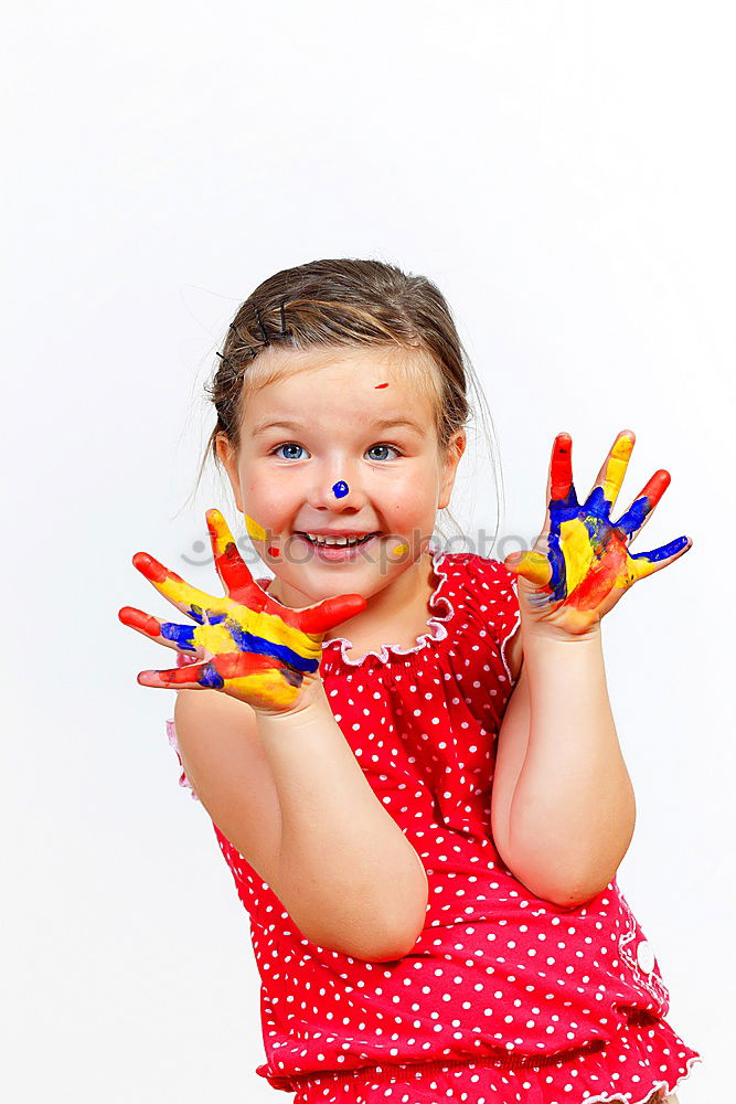 Similar – Girl with clown nose looks into the camera