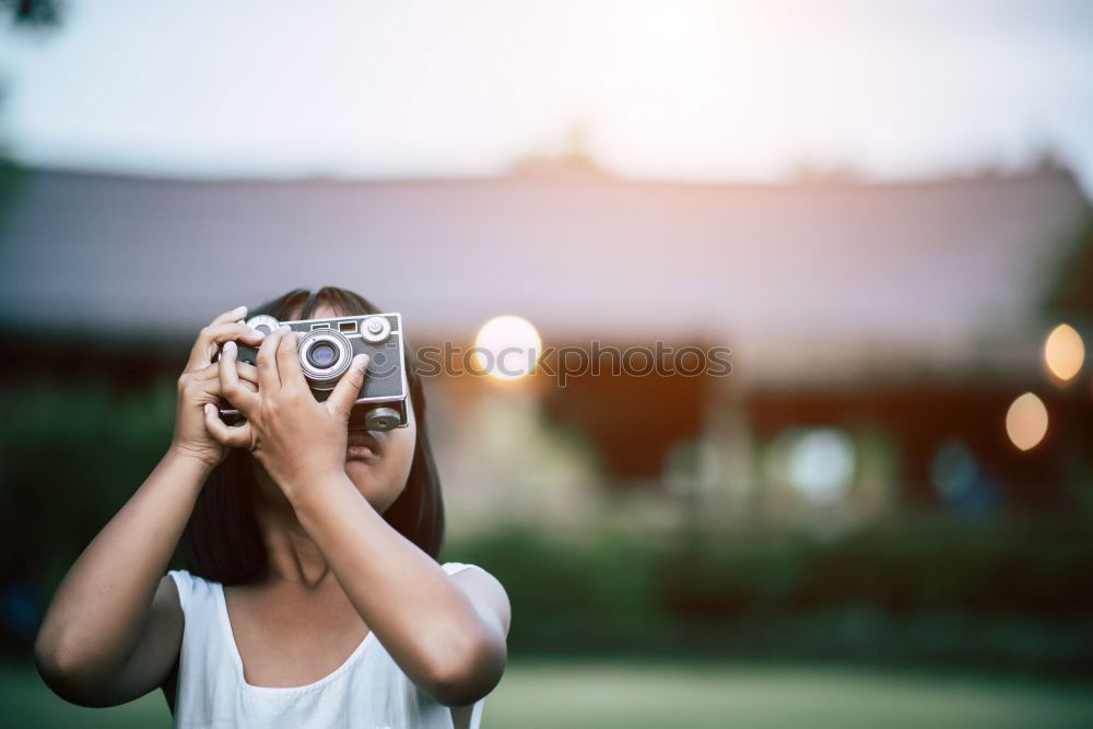 Similar – Blonde white woman holding an old VHS tape and playing with it.