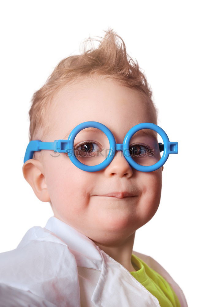 boy smiling and looking up with carboard glasses