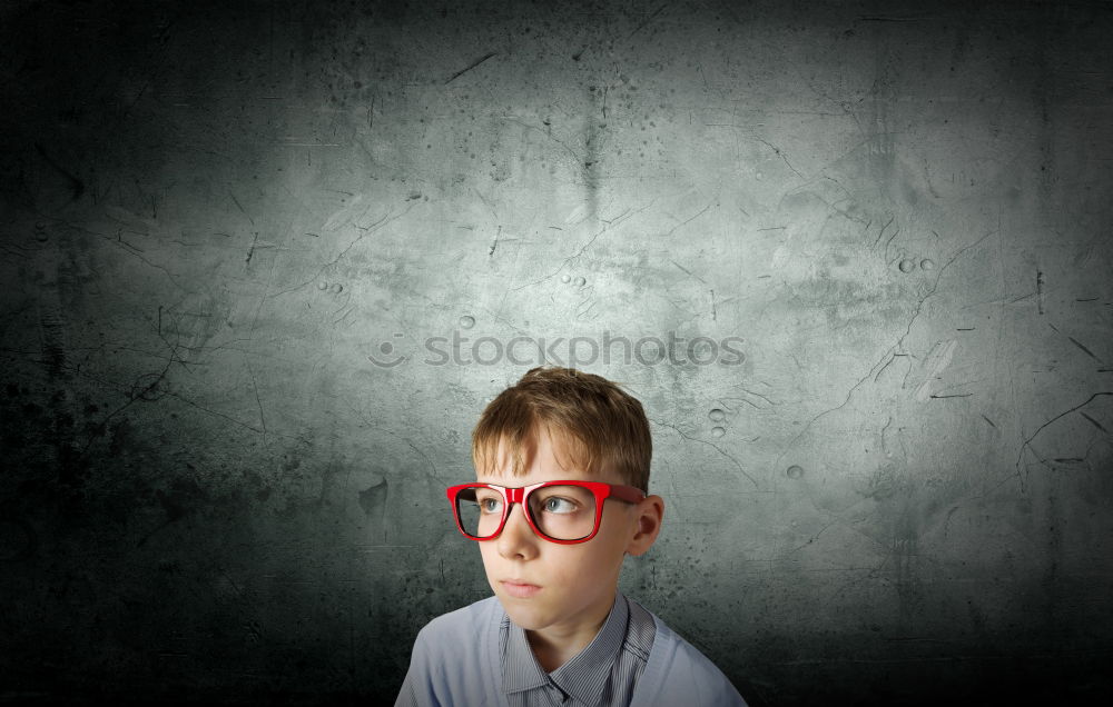 Similar – Image, Stock Photo One little boy reading to robot from cardboard boxes outdoors. Concept of science and education.