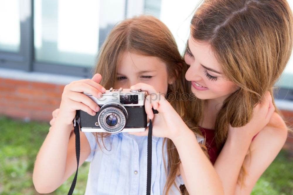 Similar – happy mother and daughter making selfie outdoor